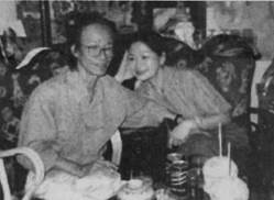 A couple of people sitting at a table
Description automatically generated